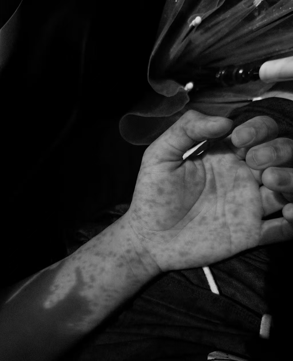 Black-and-white close-up of hands, cover for Listening | 听